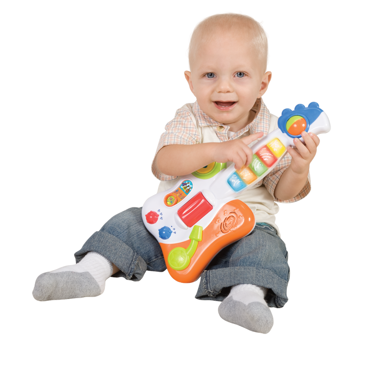 Smiling baby playing with guitar toy