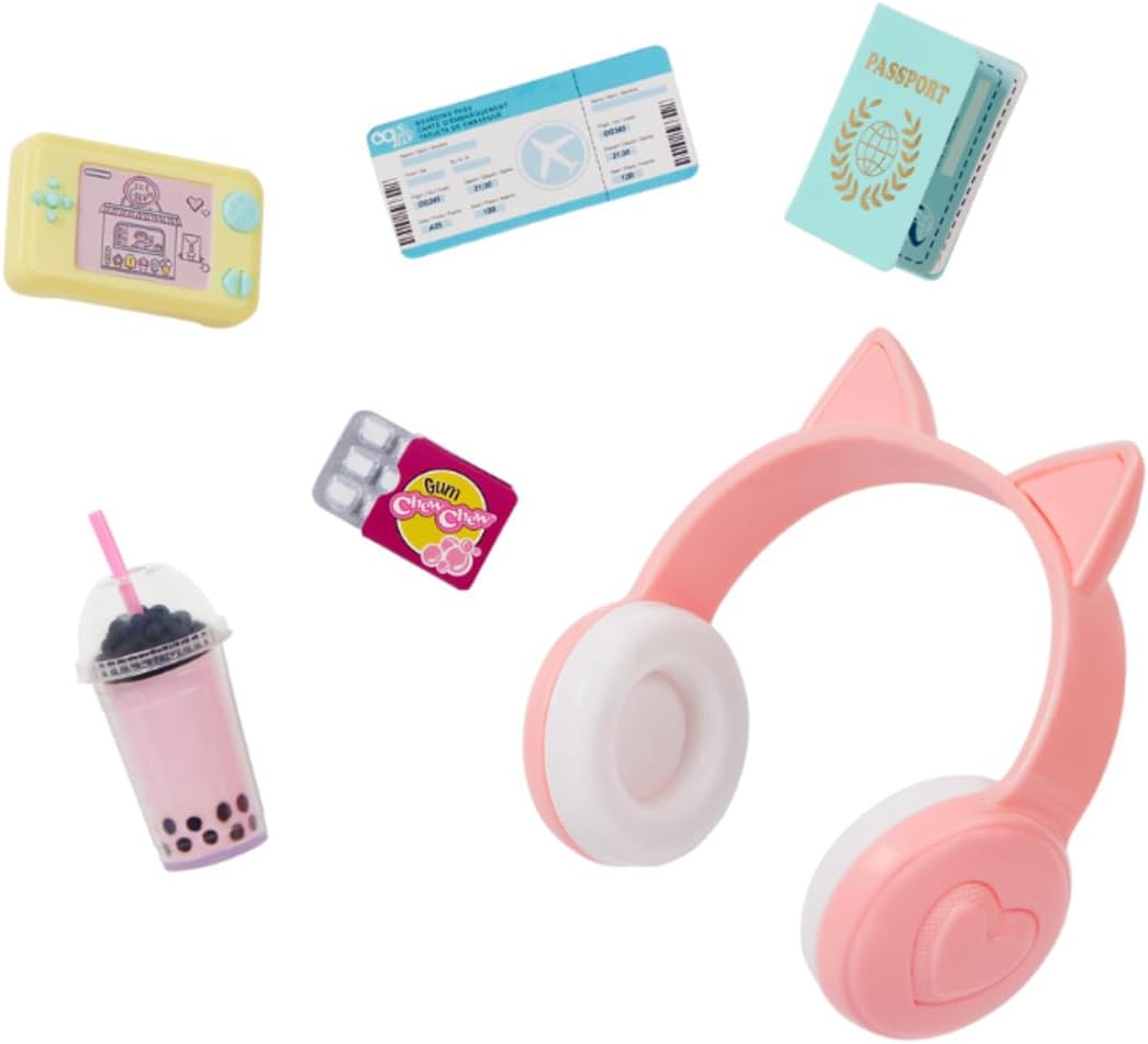 دمية بلباس وحقيبة سفر وأحذية