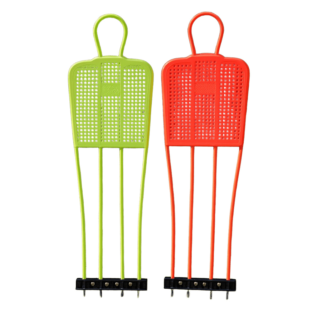 Football training dummy in green and orange for shooting and dribbling drills
