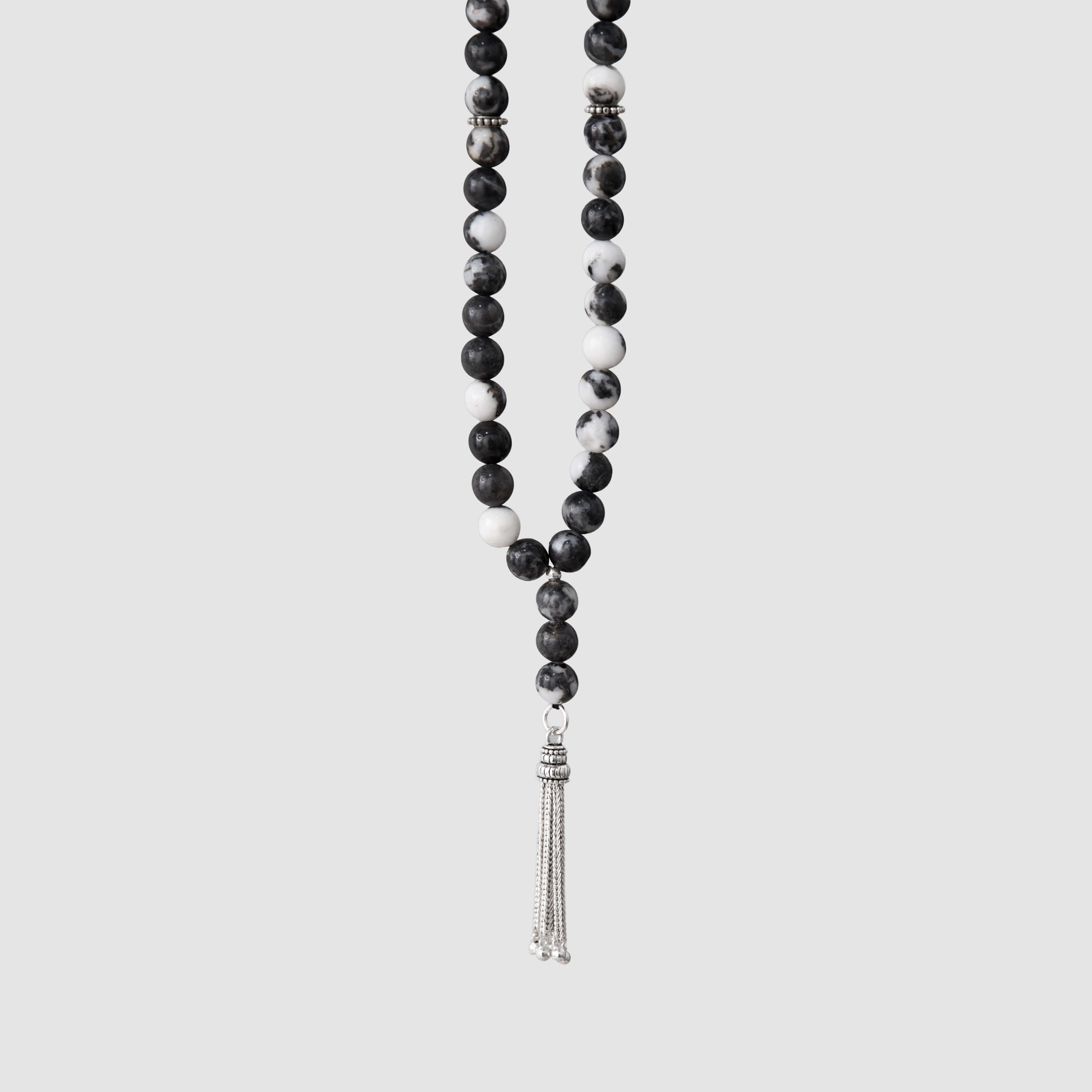 Natural zebra stone prayer beads with a silver tassel