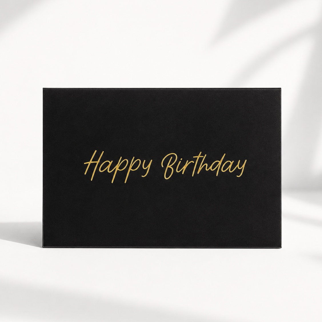 Black Happy Birthday greeting card with elegant gold lettering
