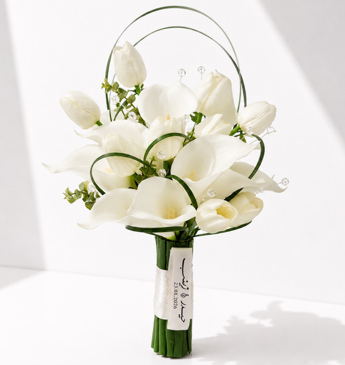  Luxury bridal bouquet featuring white calla lilies, white tulips, and crystal accents in a modern elegant design.