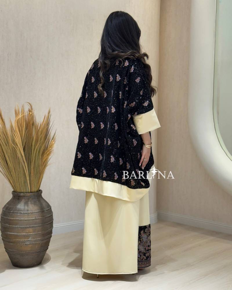 Beige jalabiya with a black floral jacket
