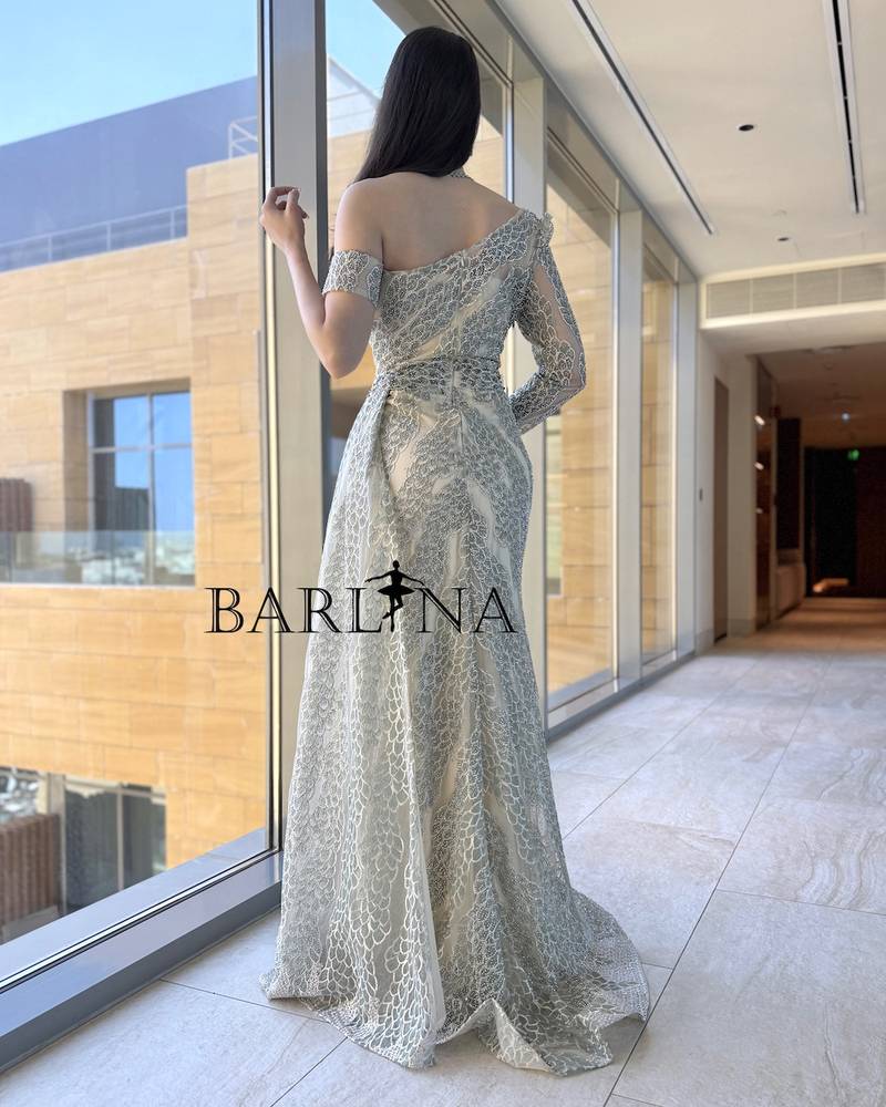 Elegant beige dress with asymmetrical sleeves