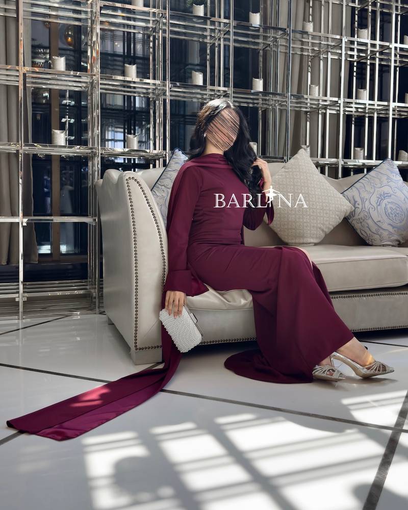 Elegant burgundy dress decorated with pearls on the back