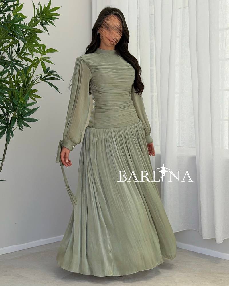 Light green pleated dress in a shiny fabric