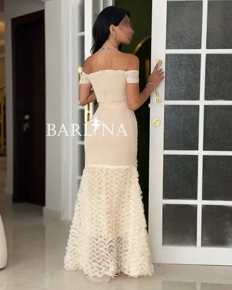 Creamy off-the-shoulder dress with ruffle details