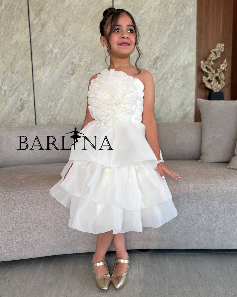 Off-white girls' dress with a large flower on the chest