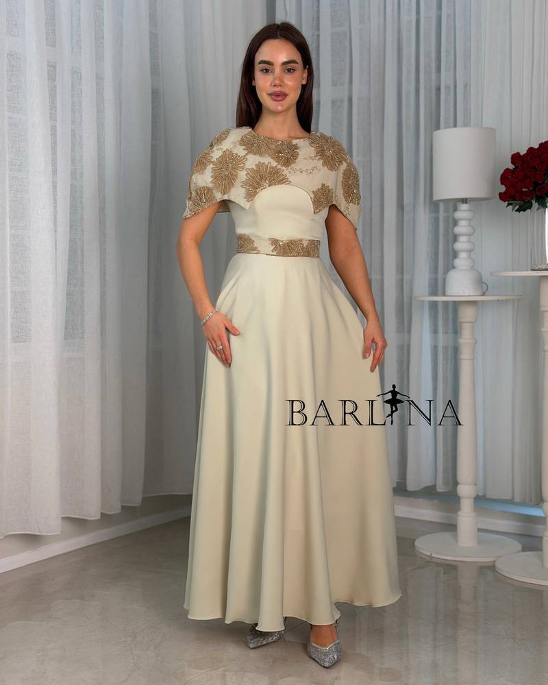 Soft beige dress with a layer embroidered with gold embroidery
