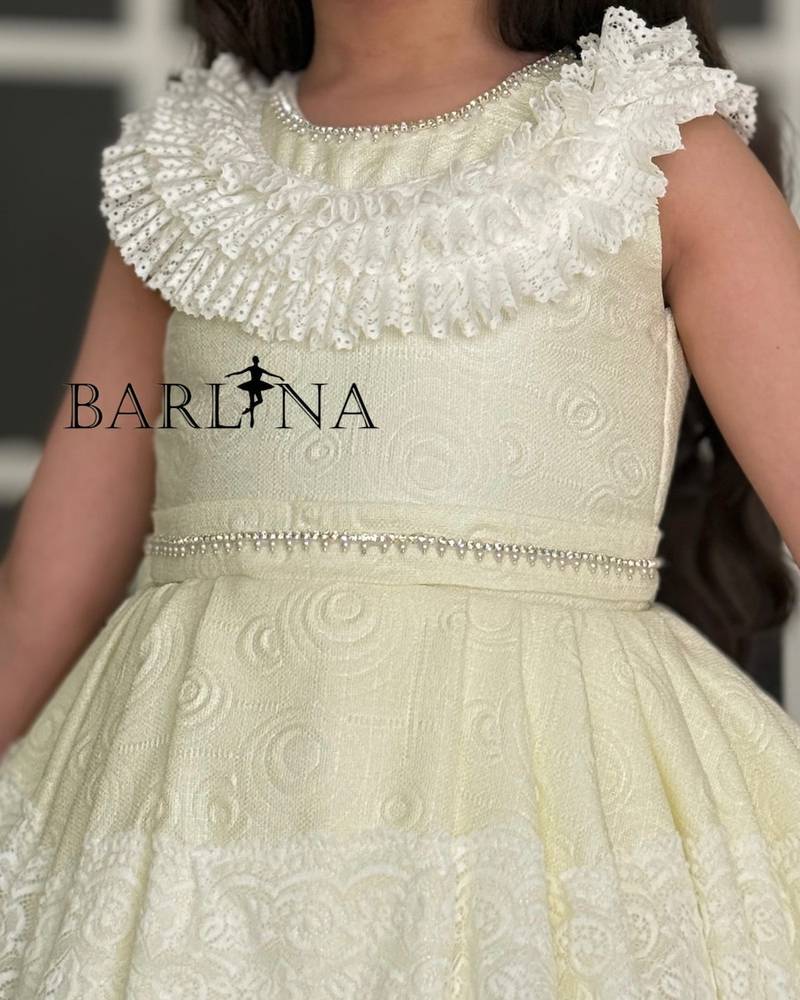 Girls' evening dress adorned with luxurious trim