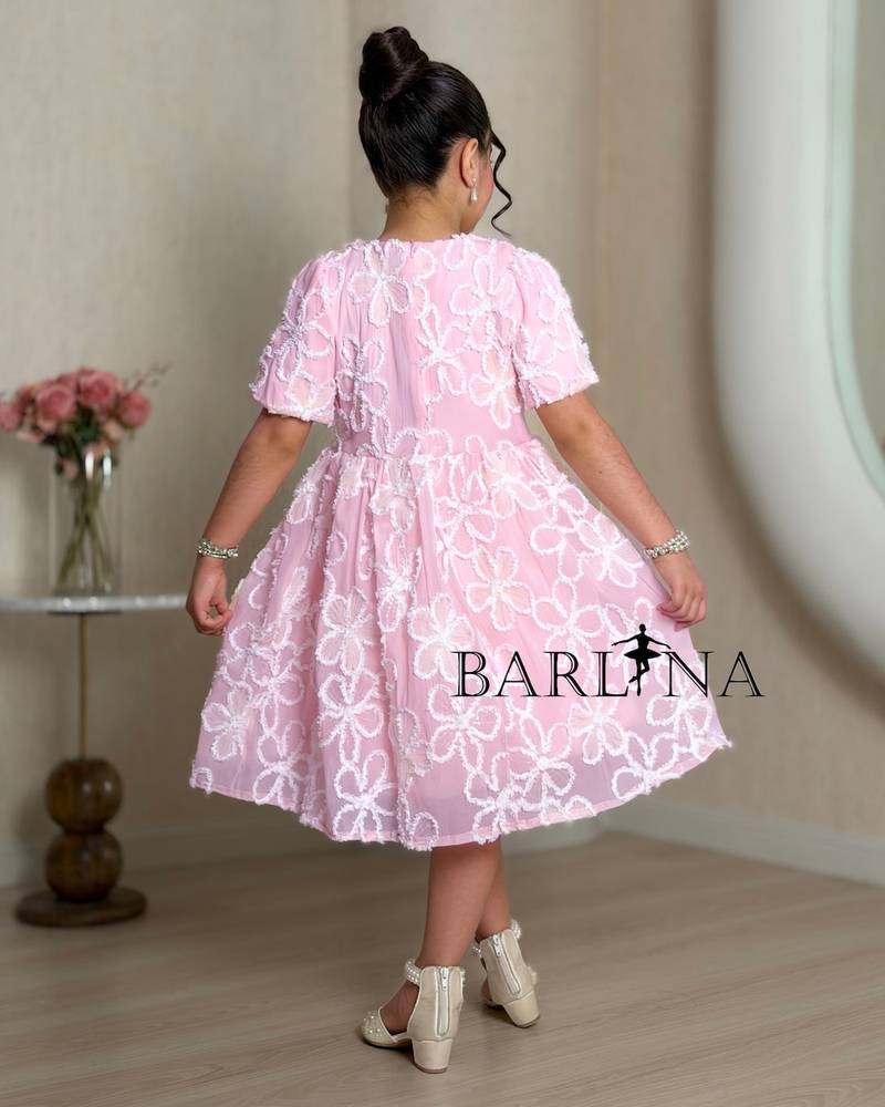Pink girl's dress embroidered with white roses