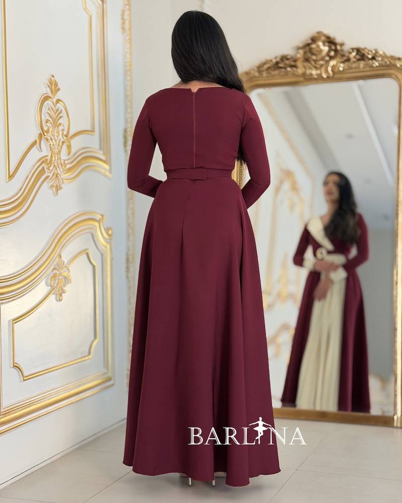 Burgundy dress with side pleats and an elegant belt