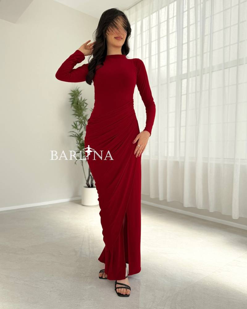 Red dress with long sleeves and side pleats
