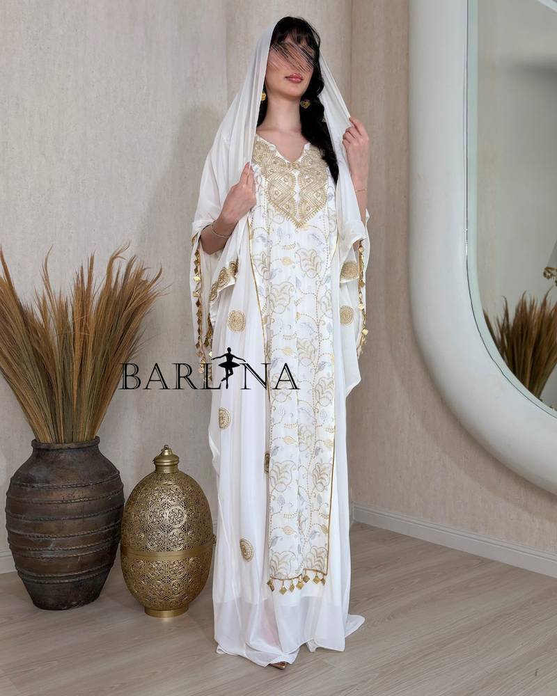 Luxurious jalabiya with gold embroidery and a shawl