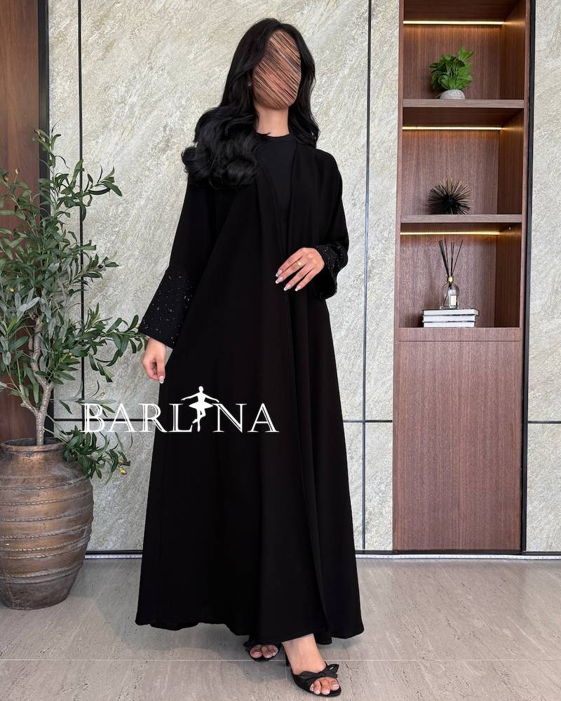 Black abaya with sleeves decorated with crystal accents