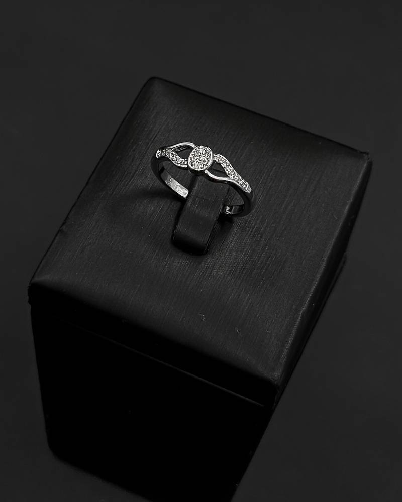 Elegant silver bracelet and ring with flowing lines