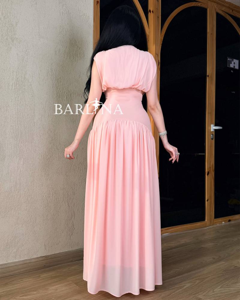 A soft pink dress with a simple and elegant design