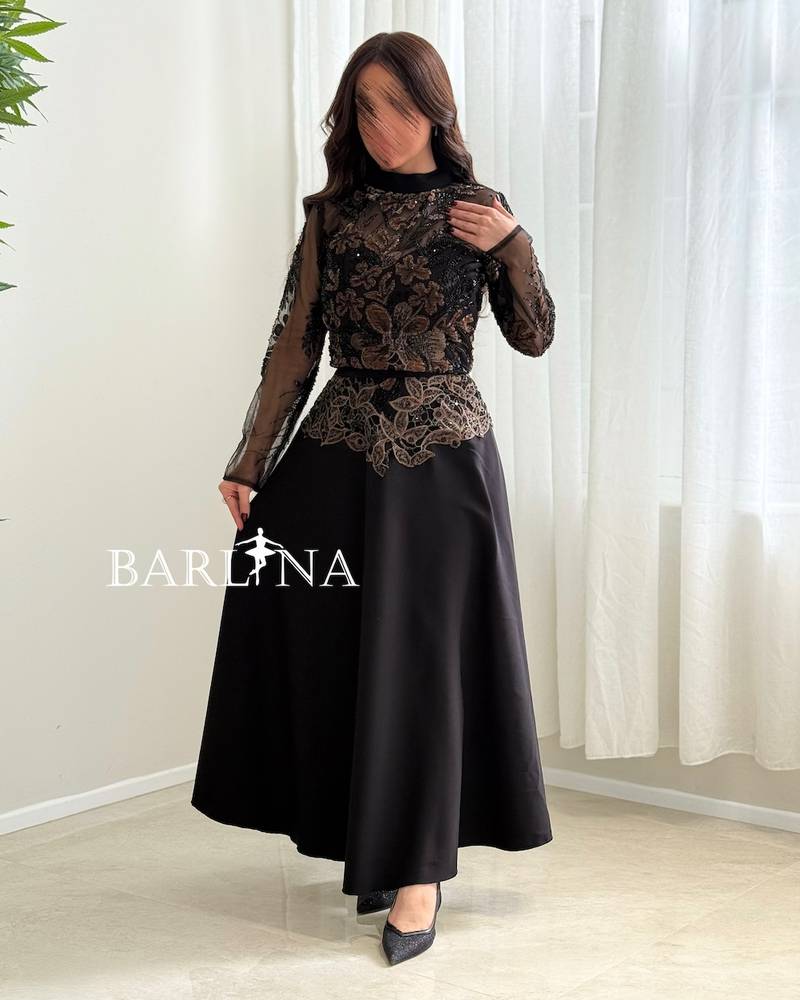 Black set with a high collar and gold embroidery