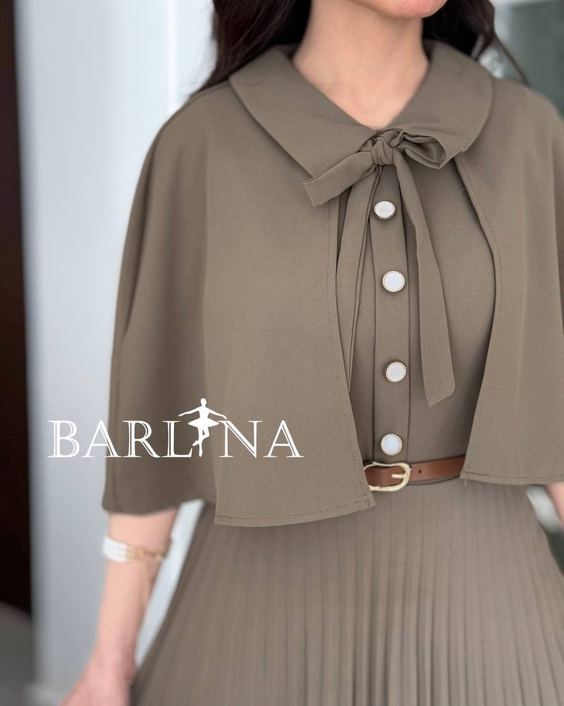 Beige pleated dress with a short flowing cape