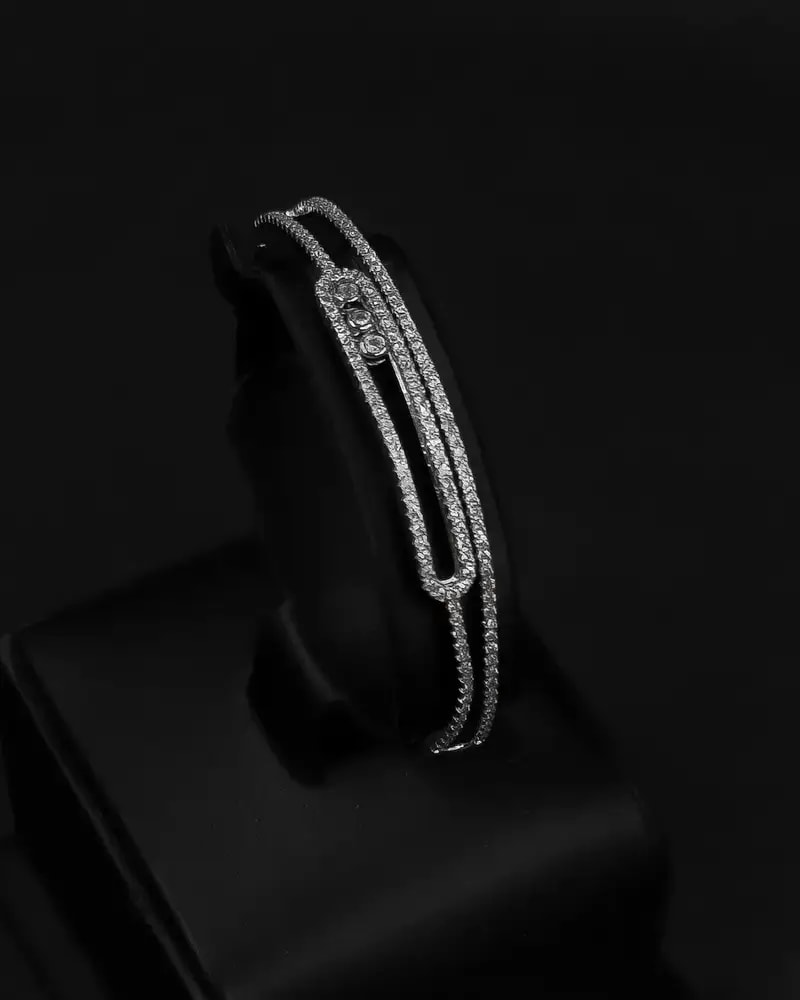 Bracelet and ring with a double zircon design