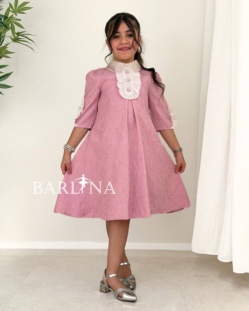 A soft, girly dress adorned with lace details.