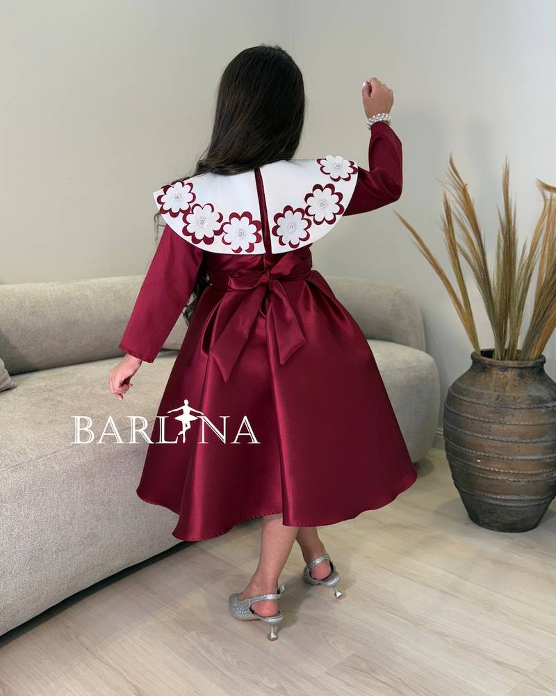 burgundy girls' dress with a white floral collar