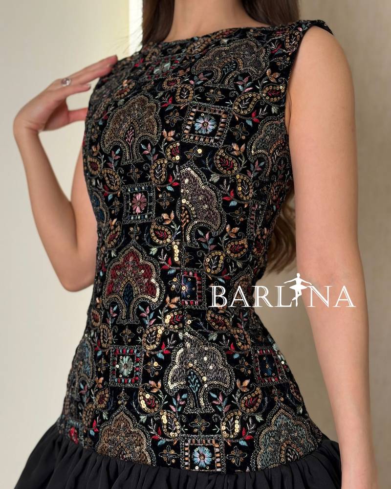 A soft dress with layers and embroidery on the top