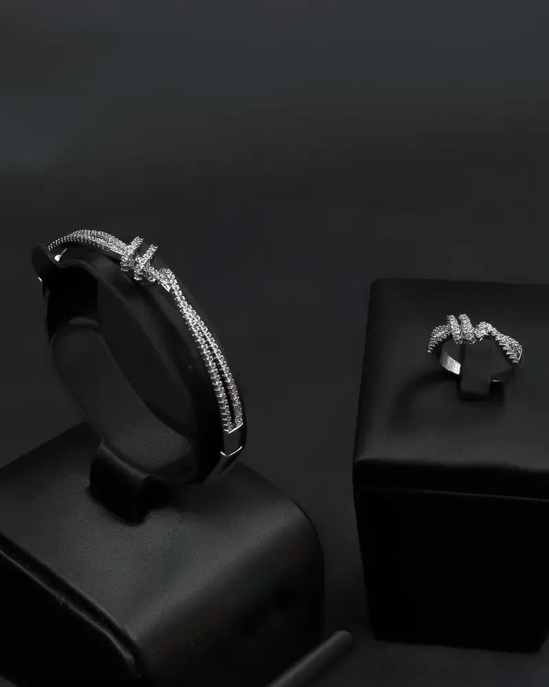 A bracelet and ring with a delicate design and prominent details.