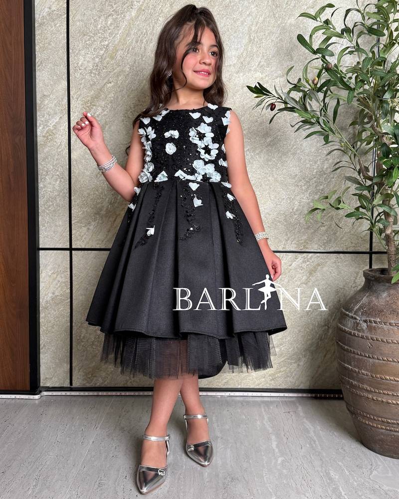 Girls' black dress decorated with sky blue roses