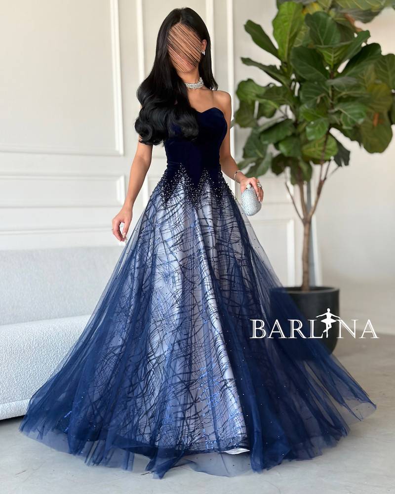 A woven dress with embroidery and shimmering gradients