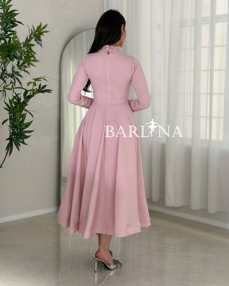 Soft pink midi dress with a feminine flared cut