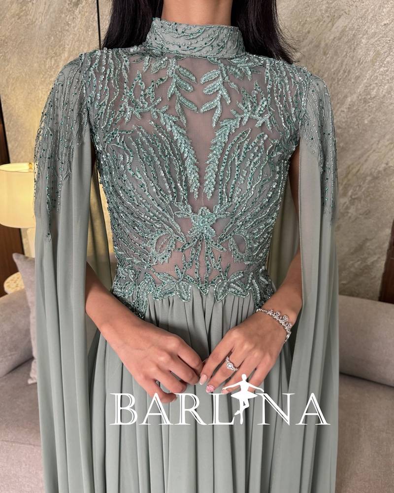Tiffany dress with royal details and a long cape