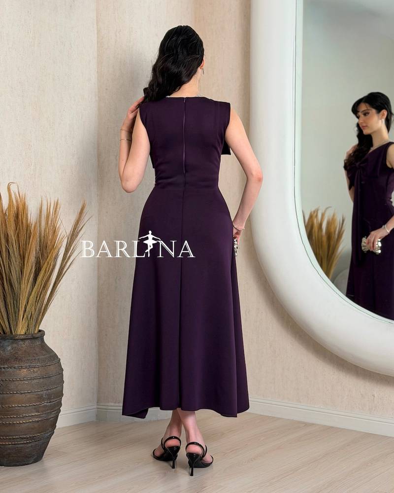 Dark purple midi dress with a large bow