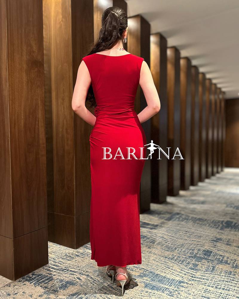 Red dress with soft pleats decorated with a rose
