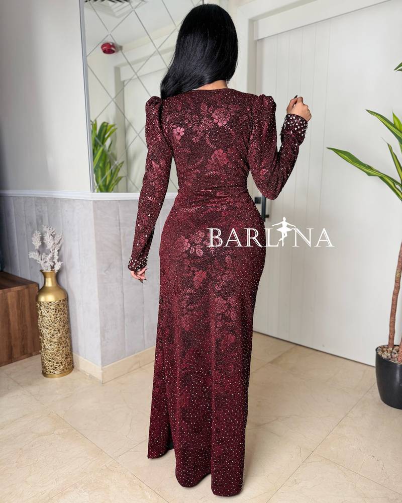 Burgundy dress with prominent sleeves and front slit