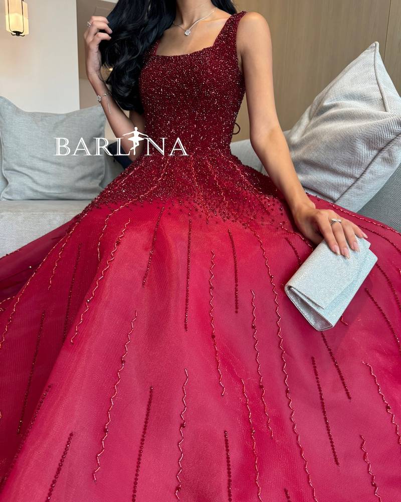 Burgundy evening dress embroidered with shiny beads