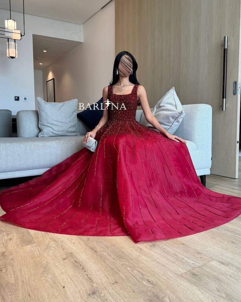 Burgundy evening dress embroidered with shiny beads