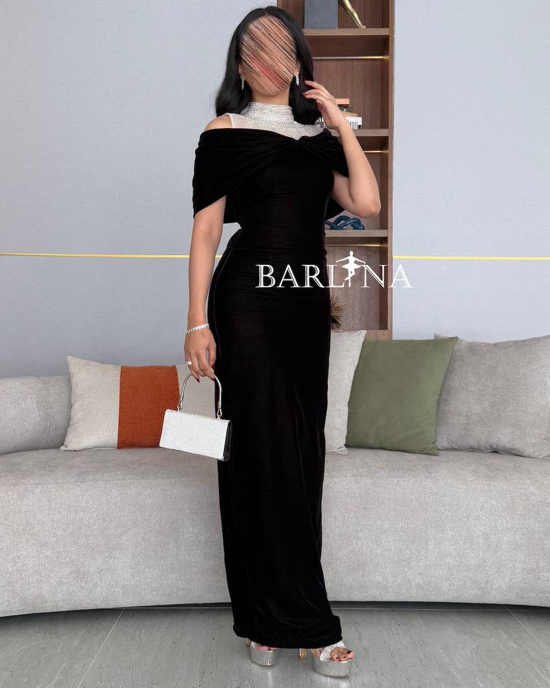 Black dress with high collar embroidered with sequins