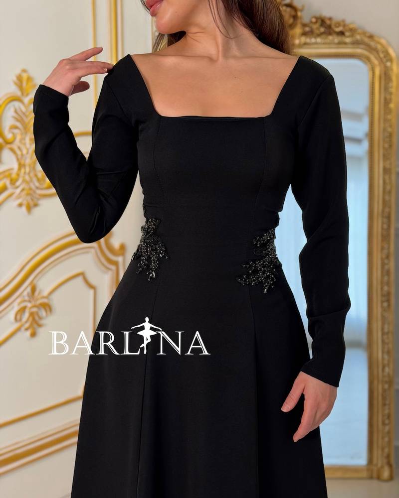 Long black dress with embroidery on the sides