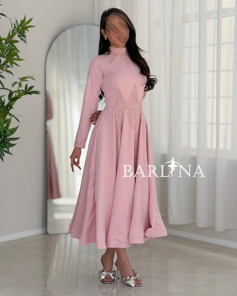 Soft pink midi dress with a feminine flared cut