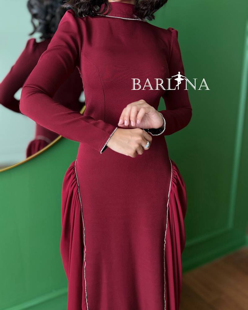 A royal burgundy dress with elegant side details