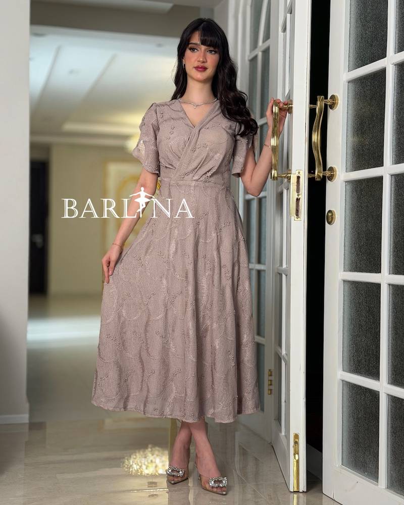 A soft V-neck dress adorned with roses