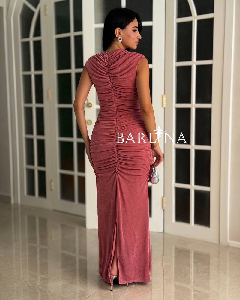 Pink fitted dress with a train in the front