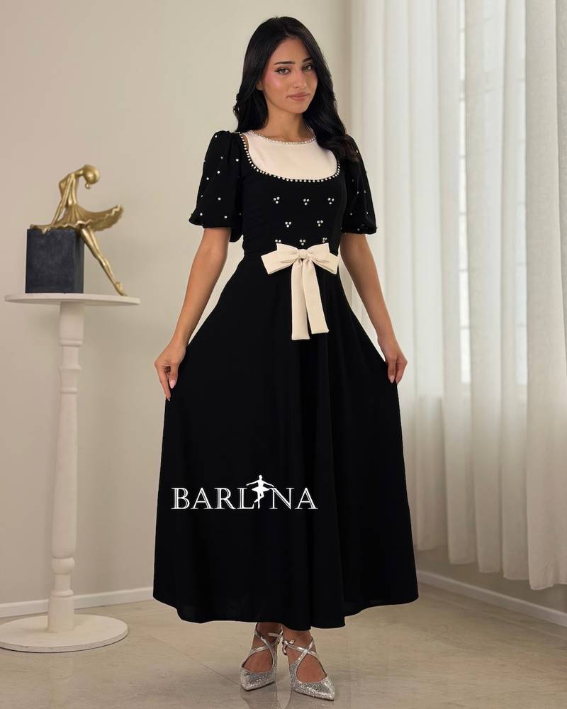Classic black dress with a crystal waist bow