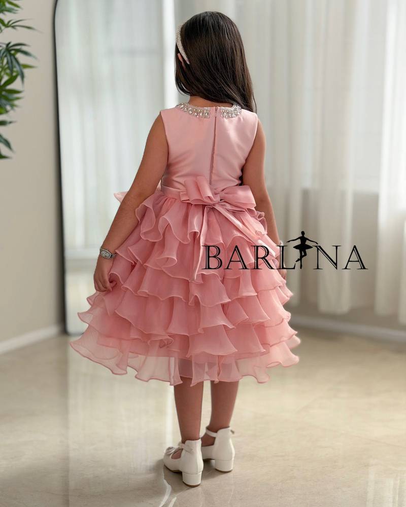 Pink layered girls' dress with a puffy cut