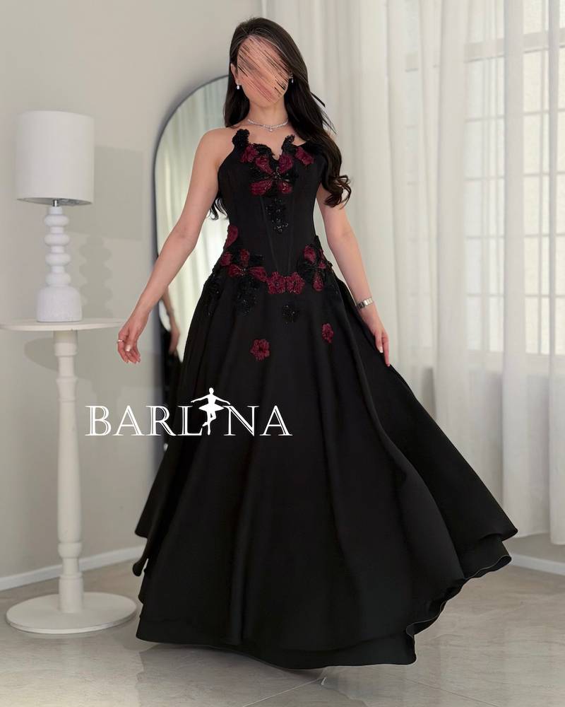 Long black evening dress with an elegant corset cut