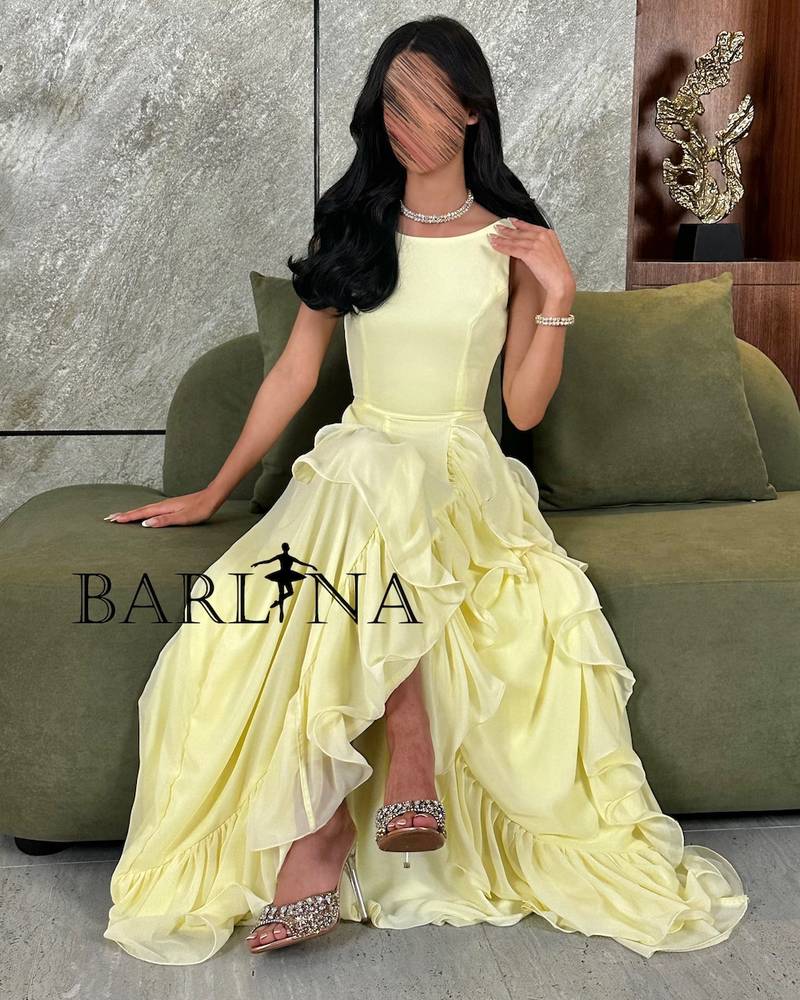 Lemon yellow dress with a slit and ruffle detail