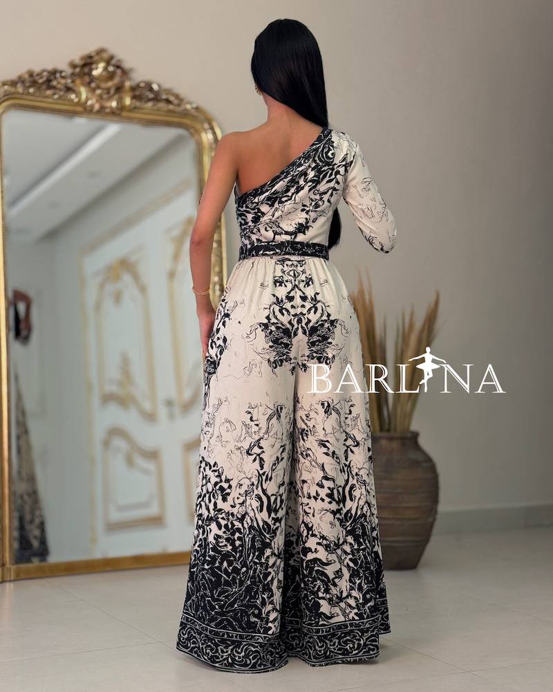 Black and white one-shoulder jumpsuit with an artistic pattern