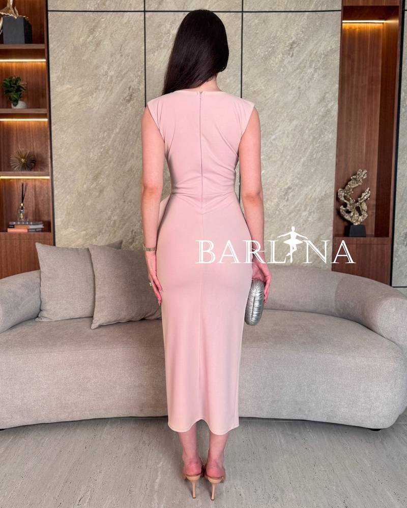 A soft light pink midi dress