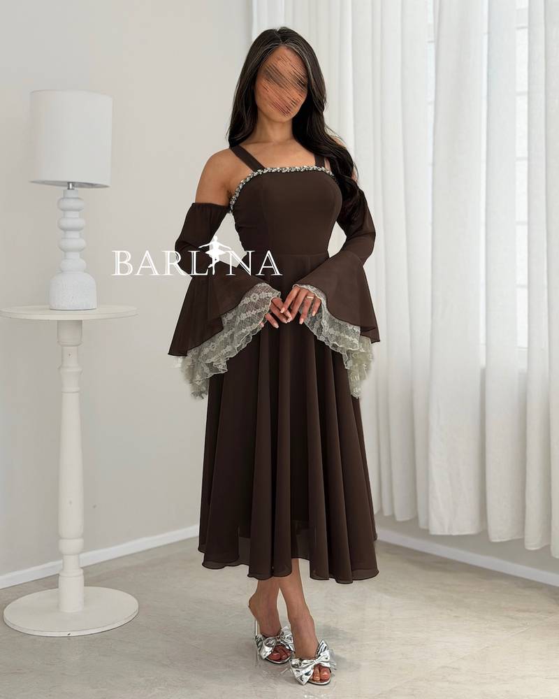 Brown dress with wide sleeves decorated with lace
